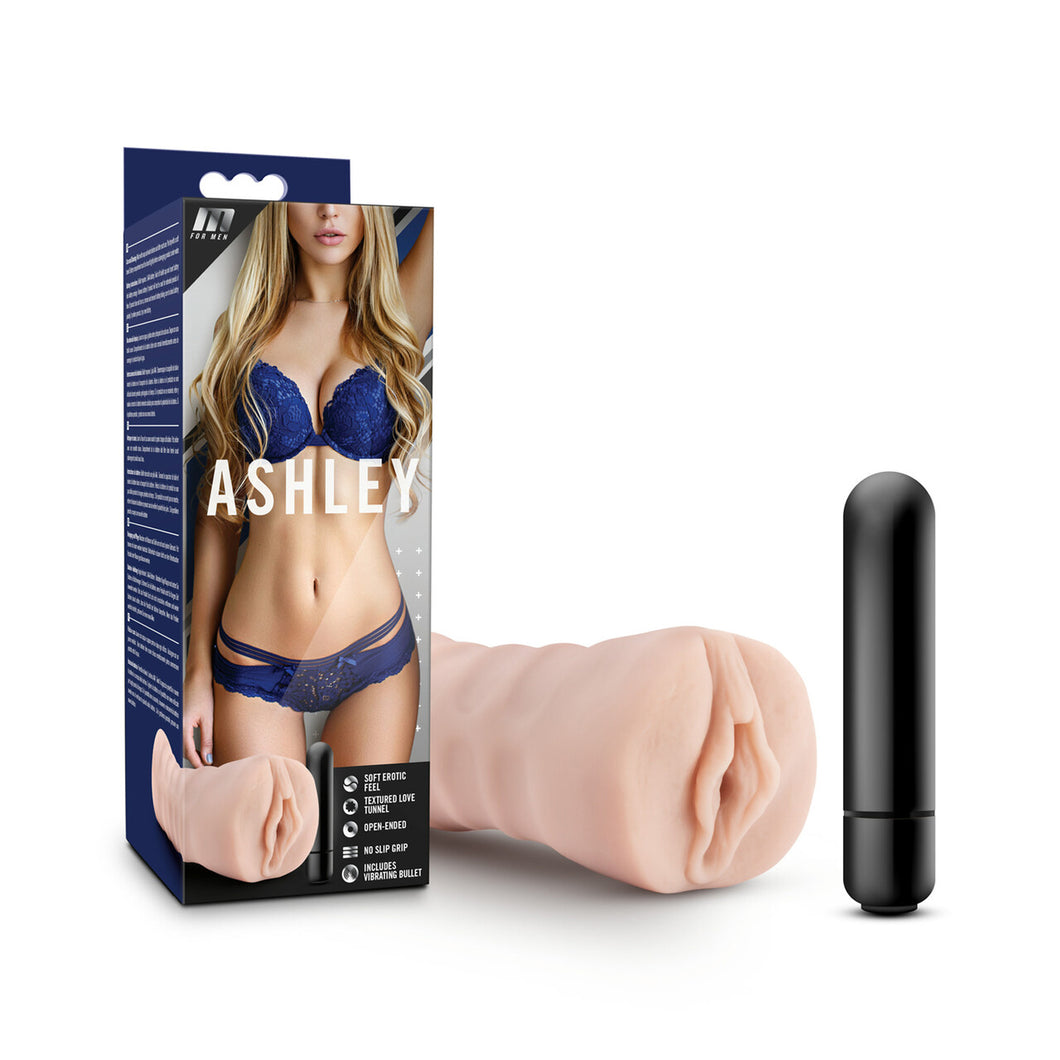 On the left side of the image is the product packaging. On the packaging is the M for Men logo, a blonde female in lingerie covers the front side, with product name: Ashley written in the middle, bottom left is an image of the product, and product feature icons for: Soft erotic feel; Textured love tunnel; Open-ended; No slip grip; Includes vibrating bullet. Beside the packaging is the stroker, laying on its side, and the bullet vibe standing beside the stroker.