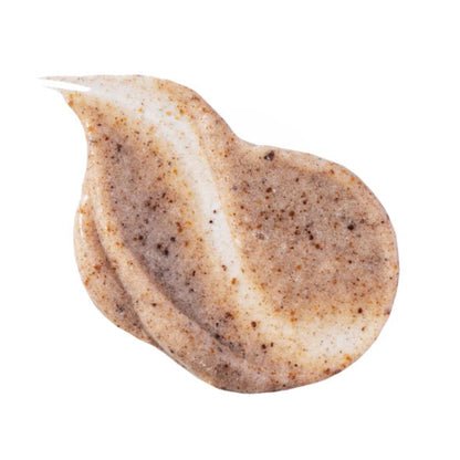 Top-down close-up view of a dollop of Beaver Butter Polishing Cream Scrub, showcasing its rich cream texture and finely ground brown exfoliating particles against a clean white background.