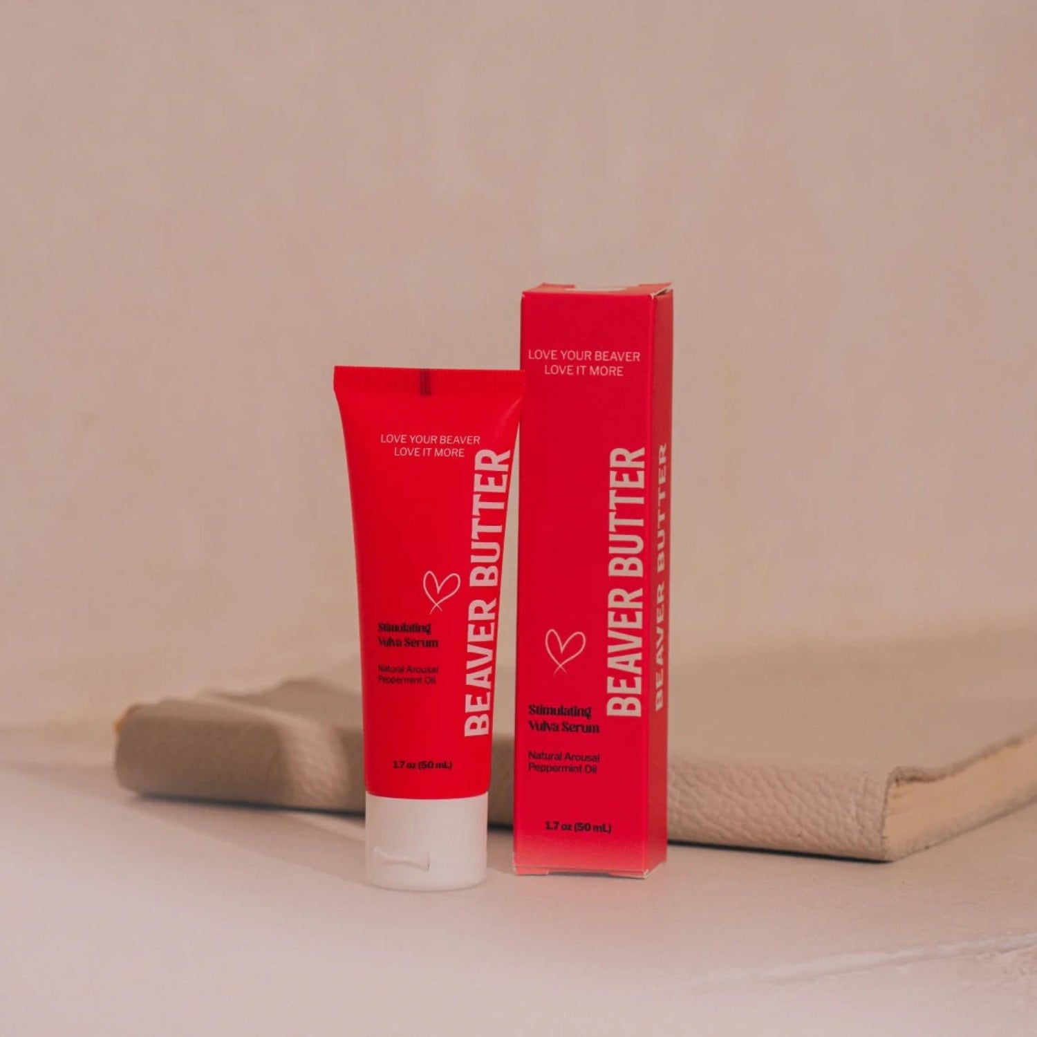 Vibrant red packaging and tube of Beaver Butter Stimulating Arousal Serum for women, 50ml, featuring Peppermint Oil for natural arousal.