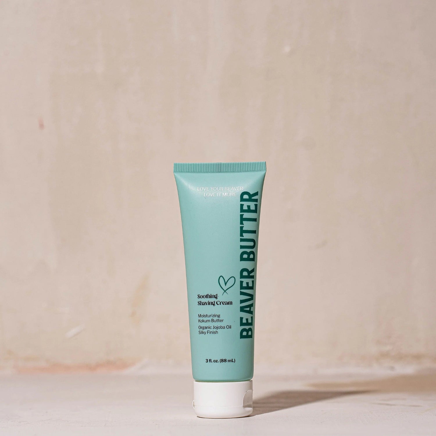 Front view of the 88 ml / 3 fl. oz Beaver Butter Soothing Shaving Cream tube with teal and white branding.
