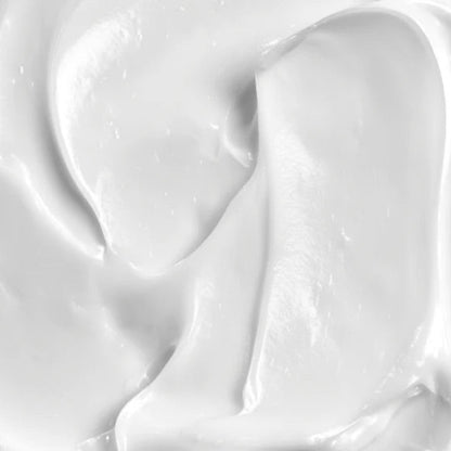 A high-resolution close-up of the thick, white Beaver Butter shaving cream texture, showing luxurious, silky swirls.