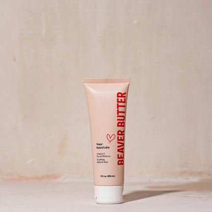 Front view of the 88 mL / 3 oz Beaver Butter personal lubricant tube featuring minimalist peach packaging and red typography.
