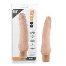 Load image into Gallery viewer, On the front of the package from the top left 8.5&quot; length, Dr. Skin logo, Cock vibe, Lab certified body safe, Fragrance free; Multispeed vibrations; Soft realistic feel; Phthalate free; Splash proof, Vibe 7. Beside the packaging is the product, standing on its base.