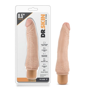 On the front of the package from the top left 8.5" length, Dr. Skin logo, Cock vibe, Lab certified body safe, Fragrance free; Multispeed vibrations; Soft realistic feel; Phthalate free; Splash proof, Vibe 7. Beside the packaging is the product, standing on its base.