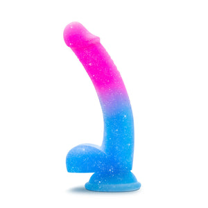 Side view of the blush Avant Chasing Sunsets Puria Platinum-Cured Silicone Dildo, placed on its suction cup.