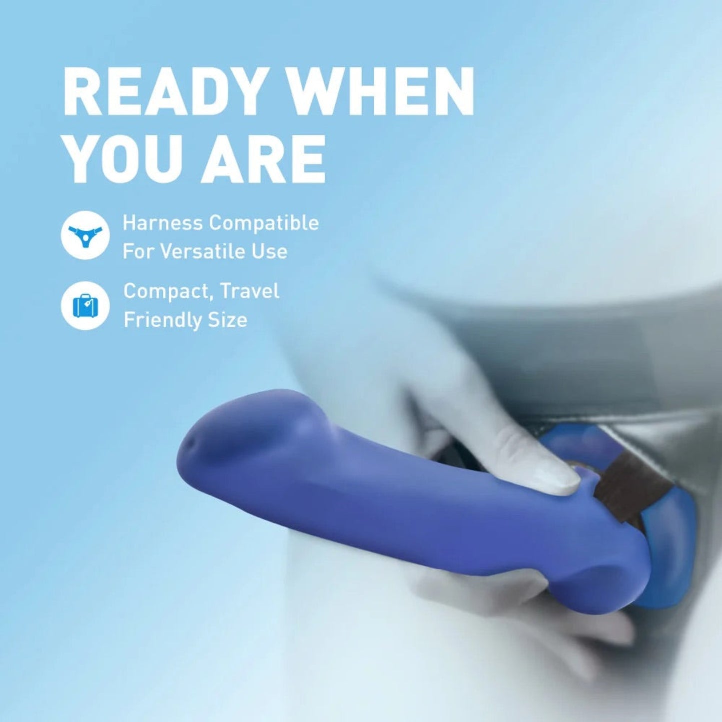 Avant Ergo Mini indigo dildo secured in a black strap-on harness, demonstrating harness compatibility and compact size.