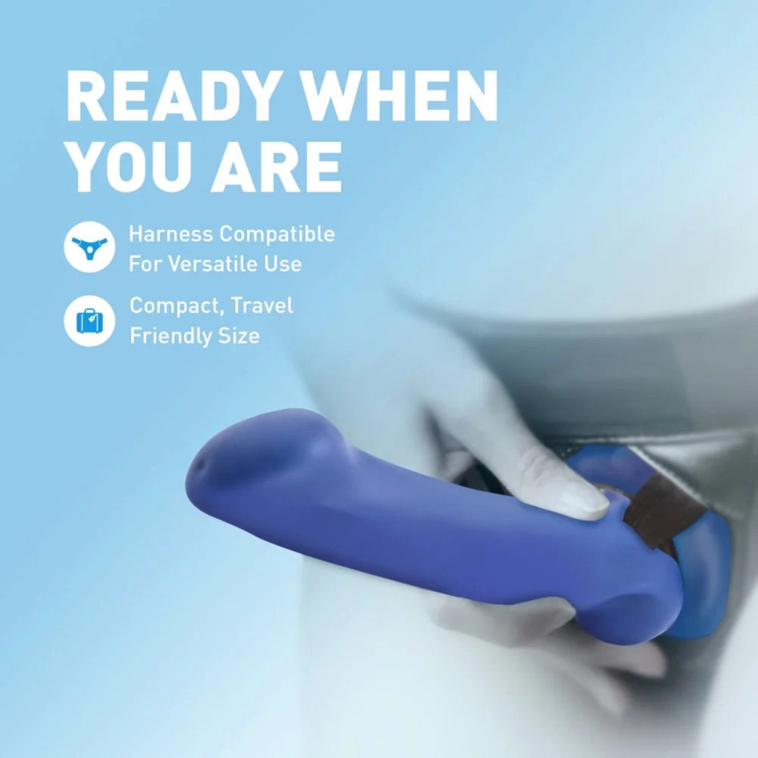 Avant Ergo Mini indigo dildo secured in a black strap-on harness, demonstrating harness compatibility and compact size.