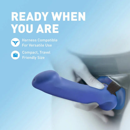 Avant Ergo Mini indigo dildo secured in a black strap-on harness, demonstrating harness compatibility and compact size.