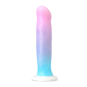 Bottom side of the blush Avant Lucky Dildo, placed on its suction cup.