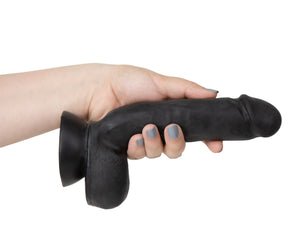 blush Au Naturel Pound 8 Inch Realistic Dildo being held, showing the size scale of how the product fits in a female hand.
