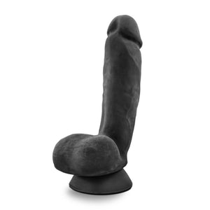 Back side view of the blush Au Naturel Pound 8 Inch Realistic Dildo, placed on the suction cup.