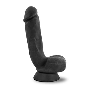 Side view of the blush Au Naturel Pound 8 Inch Realistic Dildo, placed on the suction cup.
