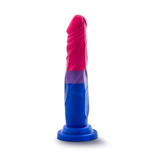 Bottom side view of the blush Avant Pride Love Dildo, placed on its suction cup.