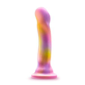 Front side of the blush Avant Sun's Out Dildo, placed on top of its suction cup.