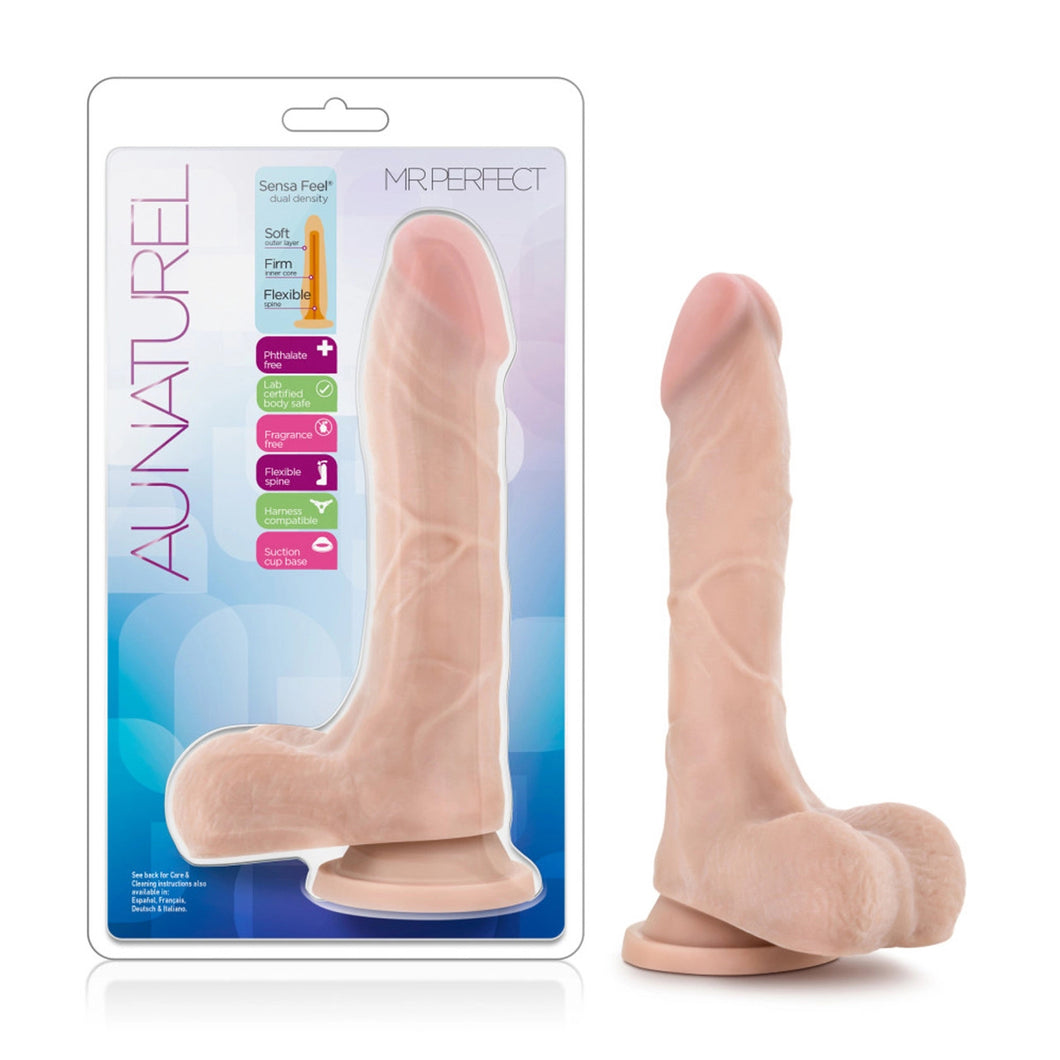On left side of image is product packaging. On product packaging Au Naturel, Sensa Feel dual density with an illustrated image of product: Soft outer layer; Firm inner core; Flexible spine, icons for: Phthalate free; Labe certified body safe; Fragrance free; Flexible spine; Harness compatible; Suction cup base, Mr Perfect, in middle is display of product, and bottom left See back for care & cleaning instructions also available in: Español, Français, Deutsch & Italiano. On right side of image is the product.