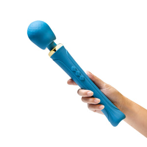 A woman's hand is holding the Blush Dianna Powerful Massage Wand, showing the size scale of the product.