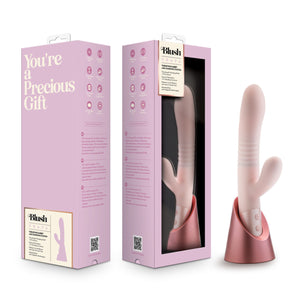 On the left side of the image is the back side of the product packaging, beside is the front side of the product packaging, and on the right side is the product Blush Fraya Thrusting Rabbit with Charging Station.