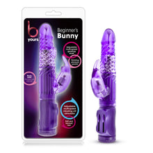 Load image into Gallery viewer, On left side of image is product packaging. Product packaging has b yours logo, Beginner&#39;s Bunny, Text bubbles &quot;Adjustable multi-speed gyrating shaft&quot; (pointing to shaft on product); &quot;rotating pleasure pearls&quot;; &quot;Adjustable multi-speed vibrating clit stimulator&quot; (pointing to bunny ears on product); &quot;Soft and sensual feel&quot;; &quot;Body safe: Phthalate and latex free&quot;, and in the middle is a cutout display of product. On right side is product out of packaging, blush B Yours Beginner&#39;s Bunny Vibrator