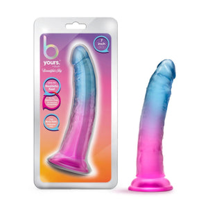 On left side of image is product packaging. Product packaging has brand name B Yours Beautiful Sky, 3 text bubbles (top to bottom): "Love my realistic feel" (pointing to left side of package); "Try my Suction Cup. It's harness compatible!" (Pointing down); "I'm body safe: Phthalate free (pointing towards the product); "7 inch dildo" (pointing to right side of packaging), and in middle is a cutout display of product. On right side of image is product blush B Yours Beautiful Sky Dildo.
