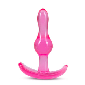Side view of the blush B Yours Curvy Anal Plug, placed on its base.