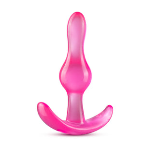 Top side of the blush B Yours Curvy Anal Plug, placed on its base.