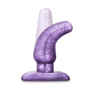 Side view of the blush B Yours Cosmic Plug, placed on its base, demonstrating its flexibility.