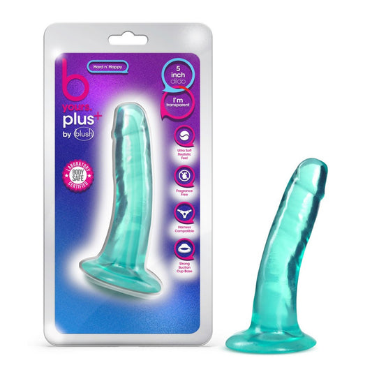 On left side of image, is product packaging. On product packaging is b yours plus logo, by blush logo, and an icon for Laboratory certified - body safe. Text bubbles: "Hard N' Happy" (pointing to product); "5 inch dildo" (pointing to product); "I'm transparent". Feature icons for: Ultra Soft Realistic Feel; Fragrance free; Harness compatible; Strong Suction Cup Base, and in middle is image of product. On right side of image is product blush B Yours Plus Hard N' Happy 5 Inch Dildo, placed on its suction cup.