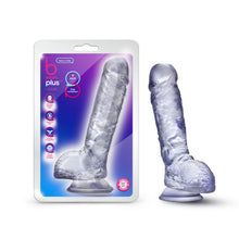 Load image into Gallery viewer, On right side of image is product packaging. On packaging (top to bottom): b yours plus logo, by blush, icon features for: Ultra soft realistic feel; Fragrance free; Harness compatible; Strong suction cup base, text bubbles: &quot;Hearty N&#39; Hefty&quot;; &quot;9 Inch Dildo&quot;; &quot;I&#39;m transparent&quot; (pointing to product). In middle is image of product, and on bottom right is icon for Laboratory tested - body safe. On right side of image is product blush B Yours Plus Heart N&#39; Hefty 9 Inch Dildo, placed on its suction cup.