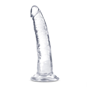 Side view of the blush B Yours Plus Lust N' Thrust 7 Inch Dildo, placed on its suction cup.