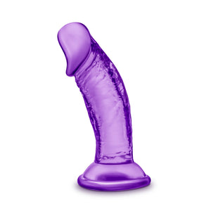 Side view of the blush B Yours Sweet 'N Small 4 Inch Dildo, placed on its suction cup.