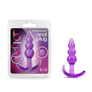 On the left side of the package is the packaging. The packaging displays b yours. logo, triple bead anal plug (product name), text bubble pointing to the product visible through the packaging inside: "tapered tip for easy insertion"; "body safe phthalate free"; contoured base conforms to your booty", and on bottom right is the blush logo. On the right side of the image is the product blush B Yours Triple Bead Anal Plug, placed on its base.