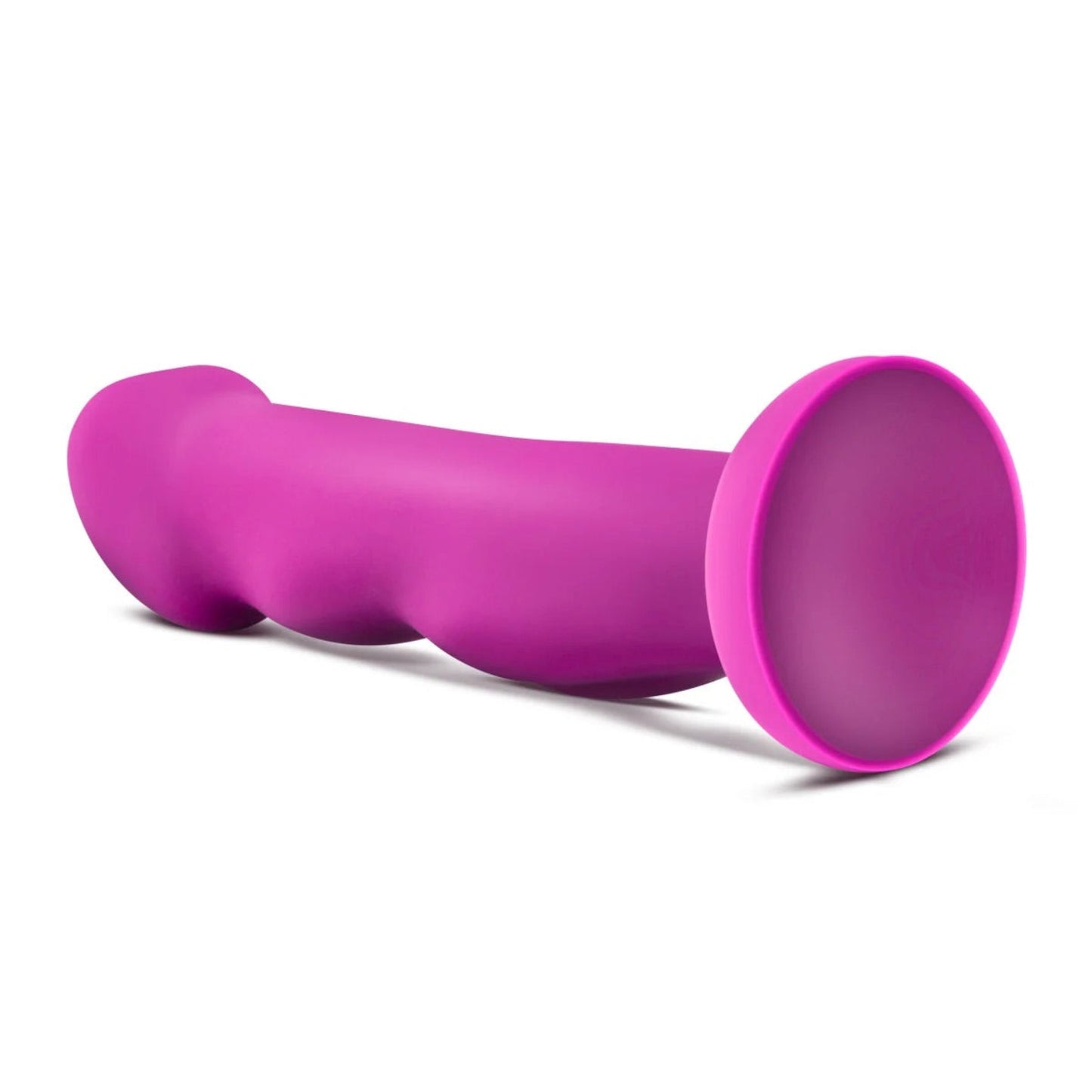 Avant Suko Violet D11 curved platinum silicone dildo lying horizontally on a white background showing the flared suction base and ergonomic shaft.
