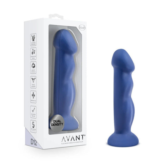 Indigo blue Avant Suko D12 dual-density silicone dildo standing upright beside its white retail packaging box with clear display window.