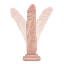 Load image into Gallery viewer, blush Dr. Skin Basic 7.5 Realistic Cock placed on its suction cup, illustrating the flexibility of the product.