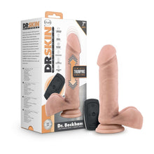 Load image into Gallery viewer, On the left side of the image is the product packaging. Beside the packaging is the product blush Dr. Skin Silicone Dr. Beckham 7 Inch Thumping Dildo, placed on its suction cup, and the wireless remote controller in between the product, and packaging.