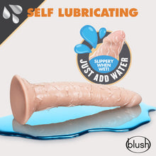 Load image into Gallery viewer, An icon for Self Lubricating, an icon for slippery when wet Just add water. Below is the blush Dr. Skin Glide 7.5 Inch Self Lubricating Dildo, placed on its top, on a reflective surface, that looks like a puddle of water. On bottom right is the blush logo.