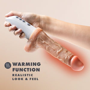 A hand holding the blush Dr. Skin Silicone Dr. Hammer 7" Thrusting, Gyrating & Vibrating Dildo in reverse showing the size scale product against a human hand, with the shaft of the dildo \glowing in red showing the warming feature. Feature icon for Warming Function Realistic look & feel.