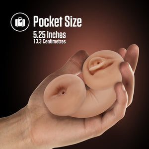 A computer generated image of a male's hand holding the blush Enlust Tasha Soft and Wet Glow In The Dark Stroker in his palm, that's bent in half showing both ends of the stroker. On the top of the image is a feature icon for "Pocket Size: 5.25 inches / 13.3 centimetres".