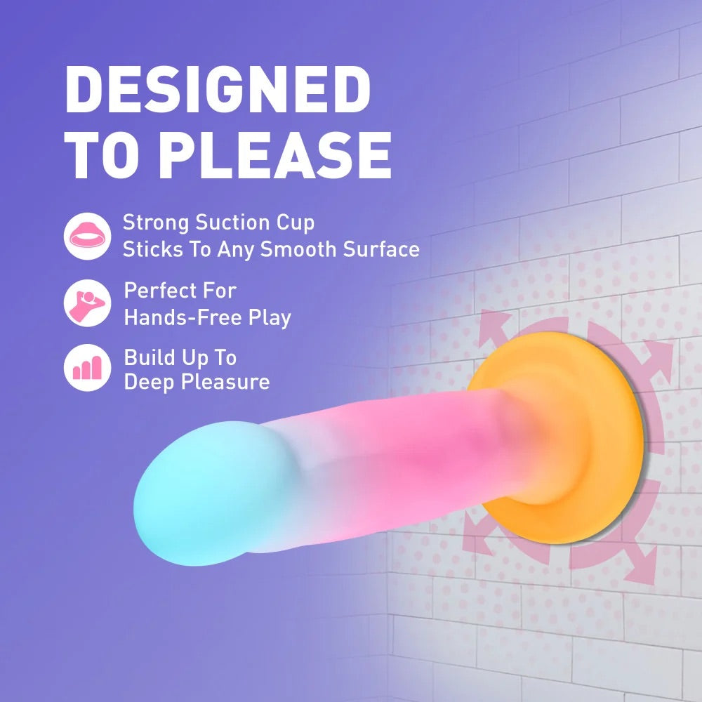 Avant Golden Dawn suction dildo mounted to a smooth bathroom wall tile demonstrating secure hands-free play.