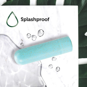An icon for Splashproof, viewing from the top, at the blush Gaia Eco Rechargeable aqua Bullet, with splashes of water around the product.