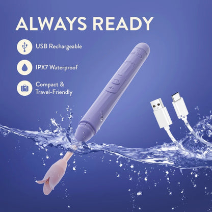 Blush Juno purple waterproof vibrator submerged in water beside USB charging cable showcasing IPX7 submersible travel-friendly design.