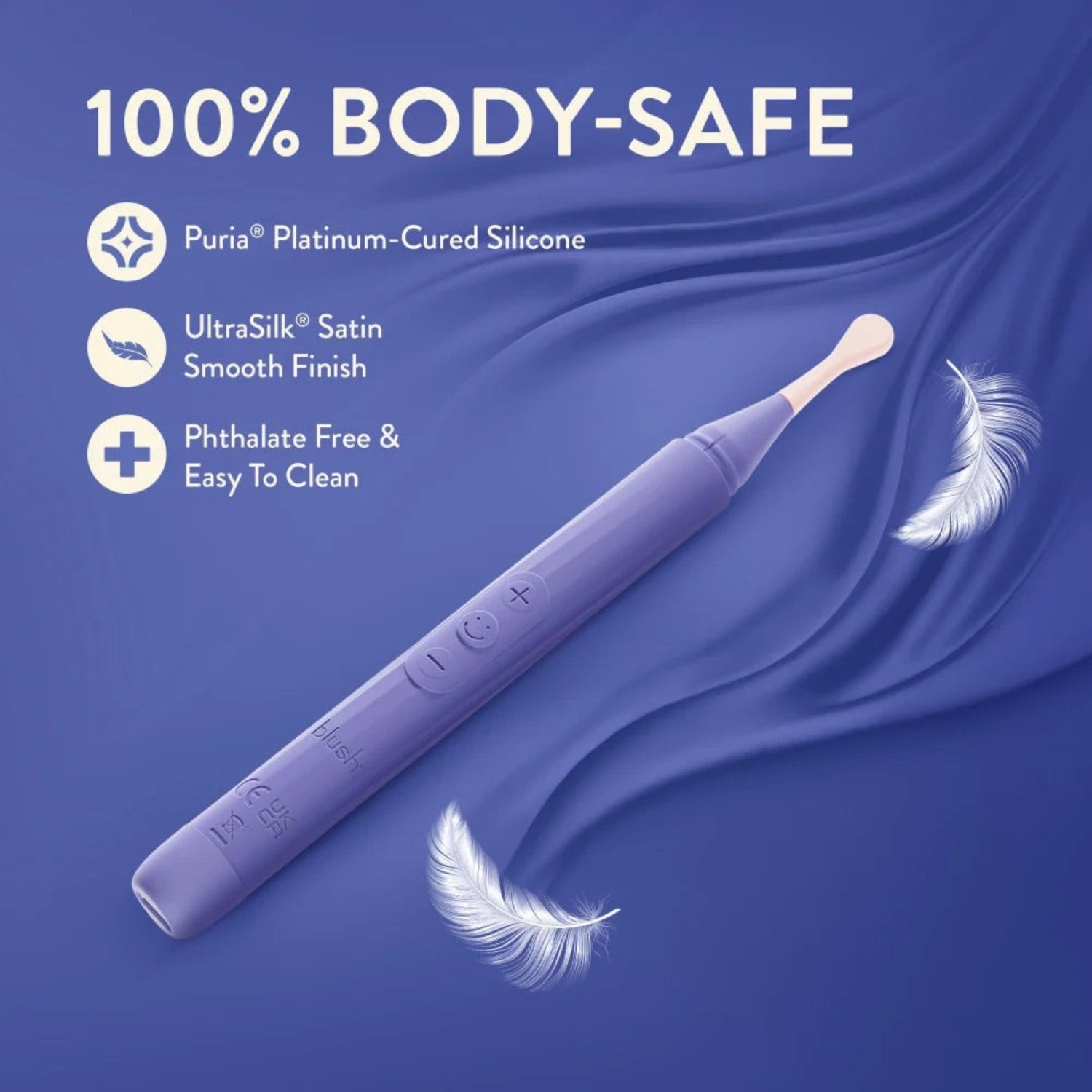 Blush Juno purple vibrating wand resting on soft silk fabric highlighting body-safe Puria platinum silicone and UltraSilk satin finish.