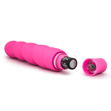 Load image into Gallery viewer, Back side view of the blush Luxe Anastasia Pink Vibrator, laying on its side, with an open battery cap, and a AA battery sticking out.