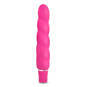 Side view of the blush Luxe Anastasia Pink Vibrator, standing on its base.