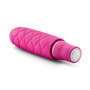 Back side view of the blush Luxe Cozi Mini Faschia Vibrator, with the power button visible at the base of the product.