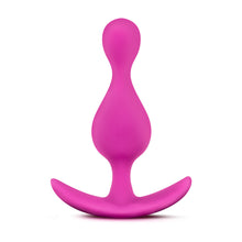 Load image into Gallery viewer, Side view of the blush Luxe Explore Silicone Pink Anal Plug, standing on its ez-handle.