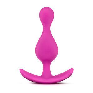 Side view of the blush Luxe Explore Silicone Pink Anal Plug, standing on its ez-handle.