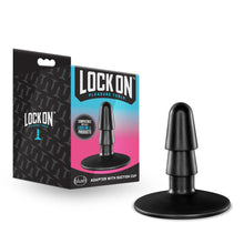 Load image into Gallery viewer, Image showing the packaging standing beside the Lock On adapter. On the left side of the packaging is the Lock On logo, on the front of the packafinf is the Lock On logo, slogan: pleasure tools, an illustrated stamp &quot;compatible with all Lock On products&quot;, an image of the product, the blush logo at the bottom, and product name: Adapter With Suction Cup.