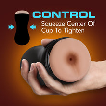 Load image into Gallery viewer, Control, squeeze center of cup to tighten, on left is an illustration of the stroker, with two arrows pointing in the middle from each side indicating where to squeeze. Below is a hand holding the blush Loverboy The Cowboy Self Lubricating Butt Stroker, facing front.