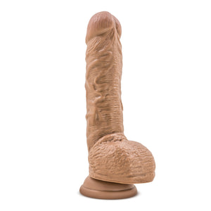 Bottom side view of the blush Coverboy Your Personal Trainer Realistic Dildo, placed on its suction cup base.